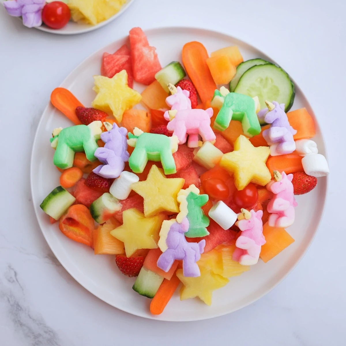 A visually stunning Unicorn Party Platter, full of sweet and savory snacks ready to be enjoyed.