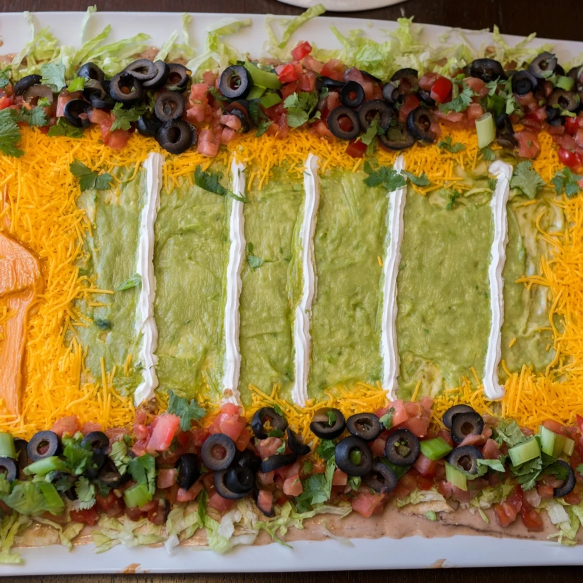 This eye-catching Football Field Dip is loaded with cheese and guacamole, ready for game day snacking.
