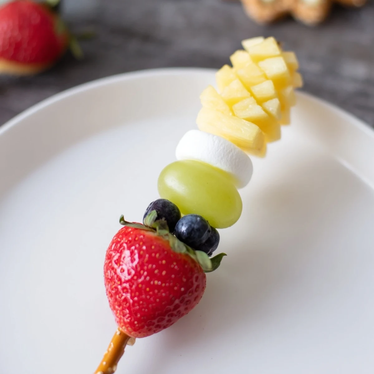 Vibrant Christmas Light Fruit Skewers offer a healthy and festive holiday snack, bursting with fresh fruit.
