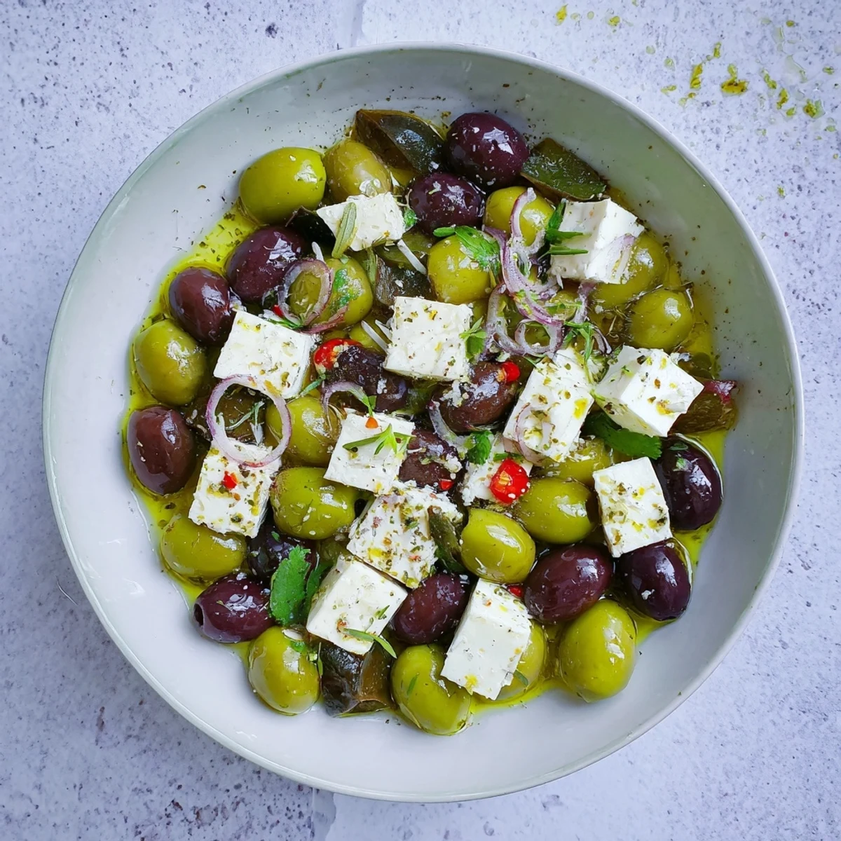 Bright, flavorful Holiday Mix of olives and feta, drizzled with olive oil and fresh herbs.