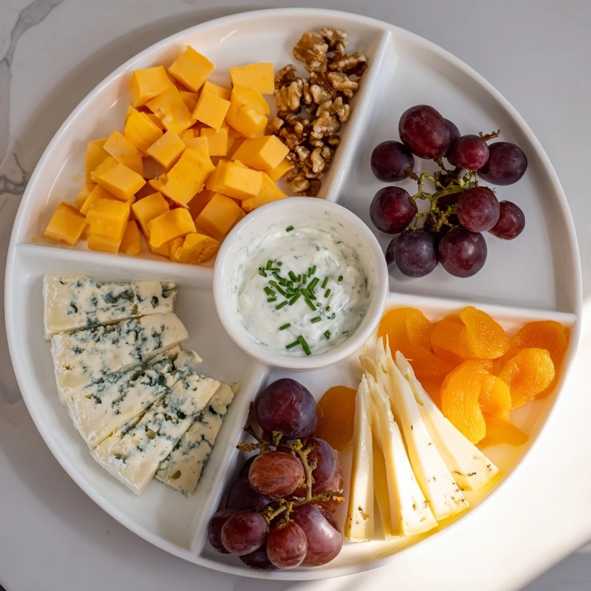 Vibrant image shows the inviting, artistic arrangement of a Celtic Cross Cheese Platter ready to serve.