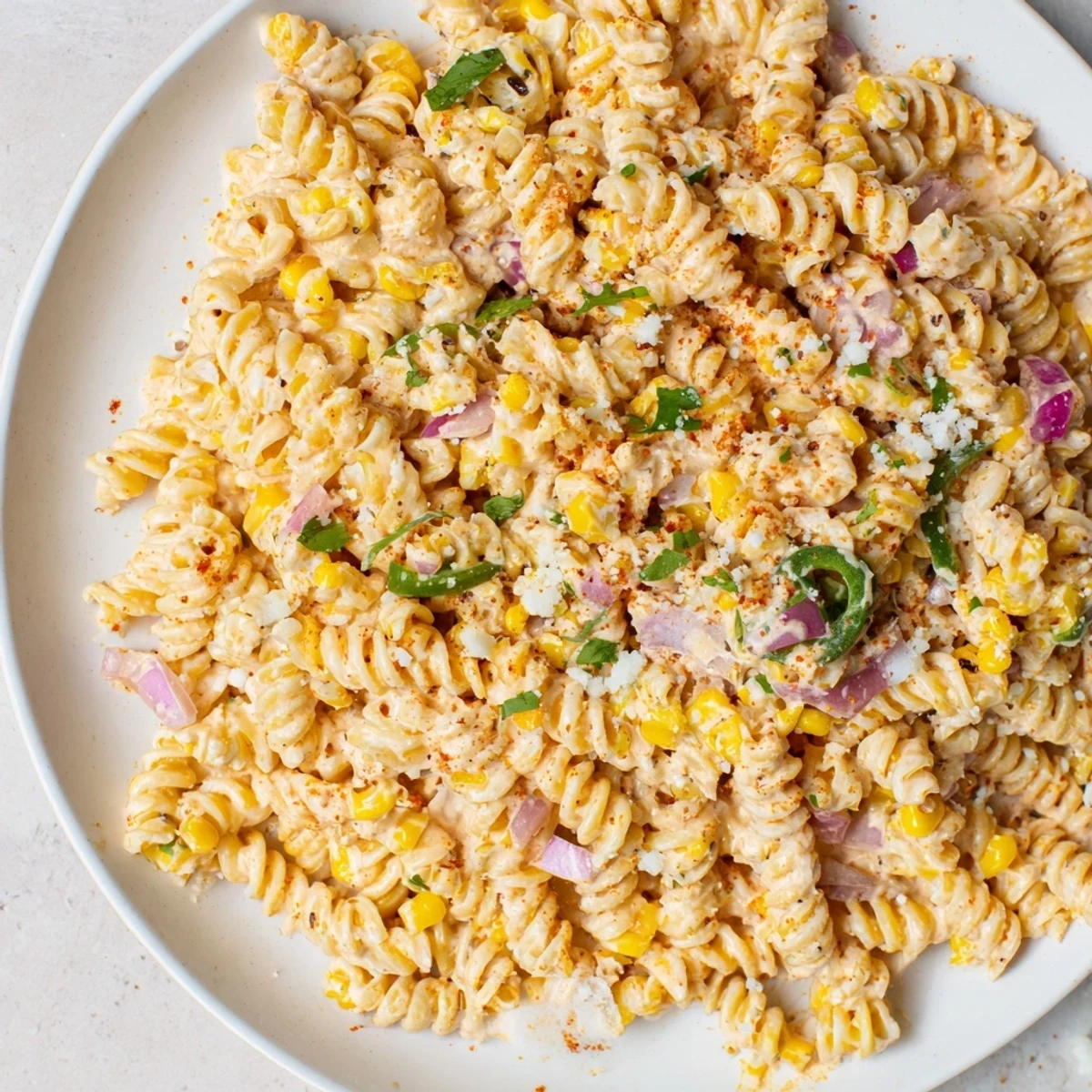 Creamy Street Corn Pasta Salad with charred corn kernels and a vibrant, creamy dressing; perfect summer side.