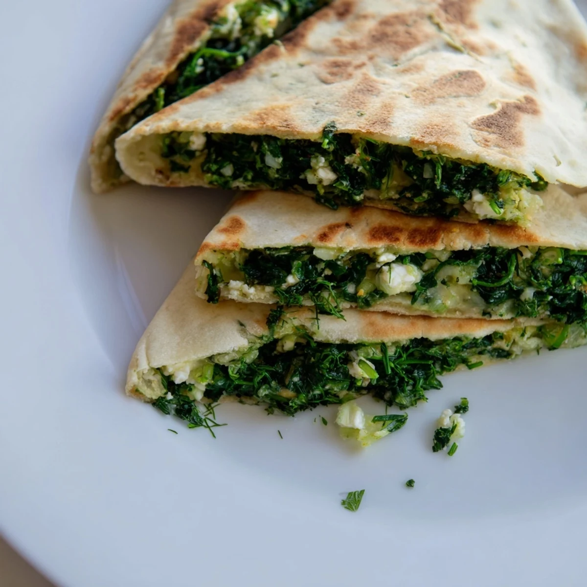 Aromatic Turkish Spinach & Feta Flatbread, showing a freshly baked flatbread with a bubbly, cheesy interior.