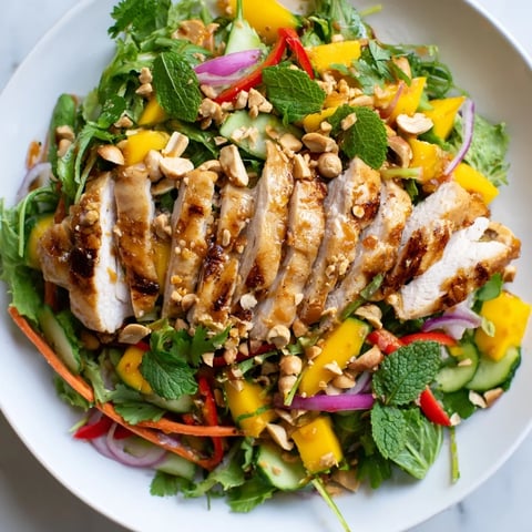Fresh Thai Mango Chicken Salad with bright mango slices and juicy chicken for dinner.
