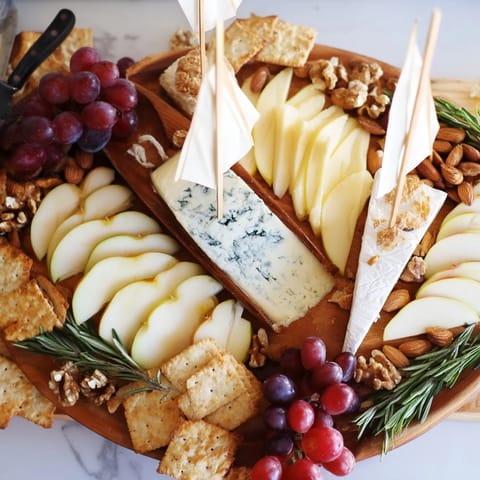 Sailboat Cheese Platter with colorful fruits, nuts, and crackers arranged for an elegant appetizer.