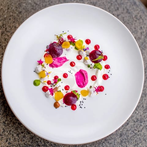 This stunning Pointillism Dot Matrix features a beautiful display of veggie purees and garnishes.