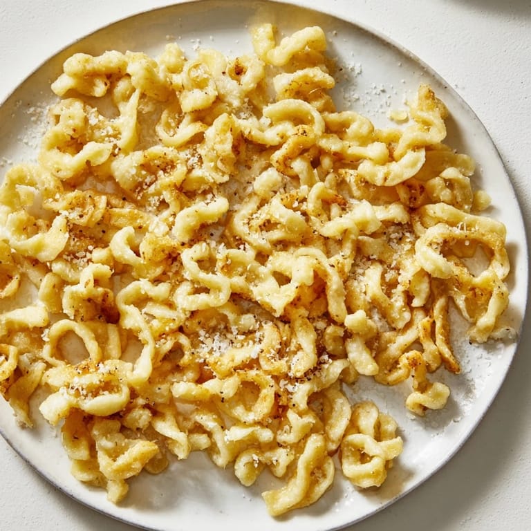 A close-up of Air Fryer German Spätzle showcasing perfectly browned, textured, delicious results.