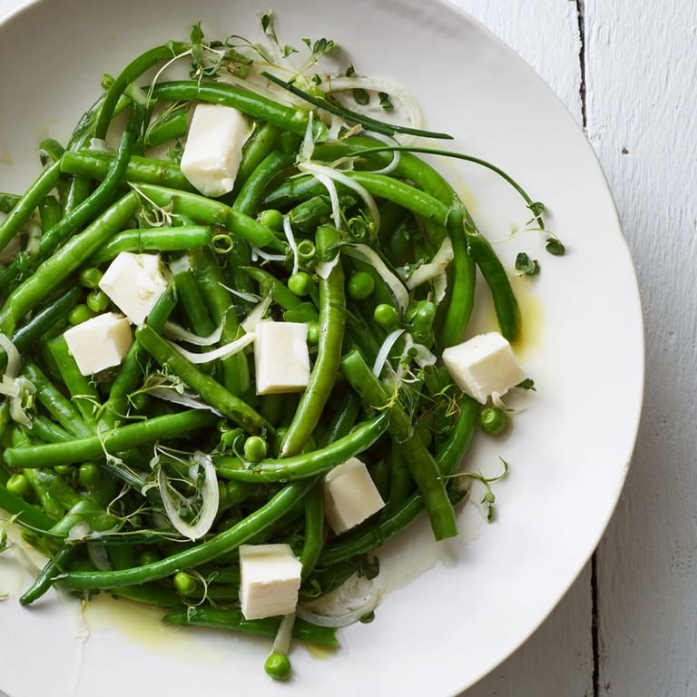A beautiful serving of English Ivy salad displays crisp green vegetables with sharp white cheddar.