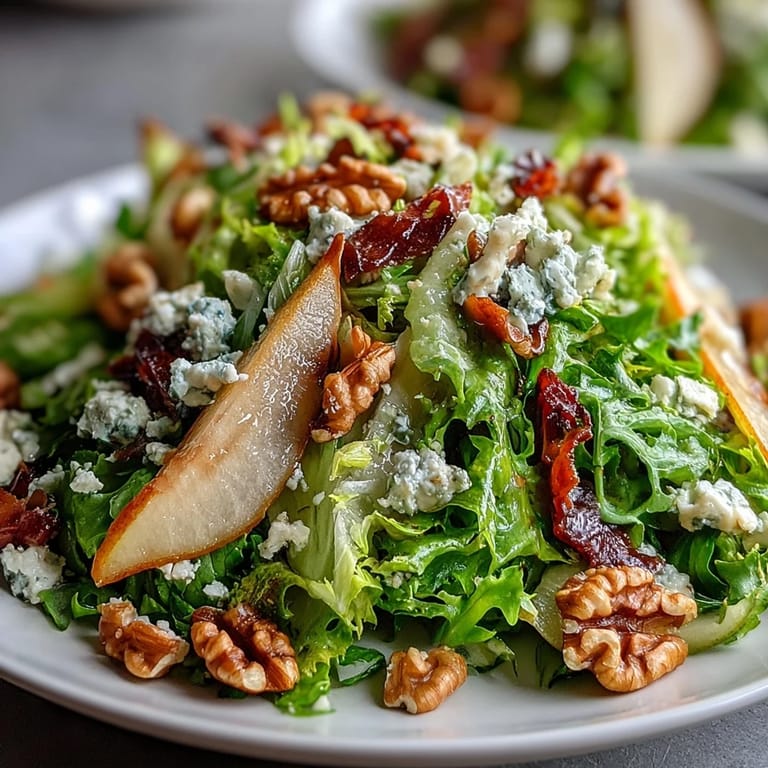 Elegant Frisée, Pear, Blue Cheese, and Crispy Prosciutto Salad, ready for lunch.