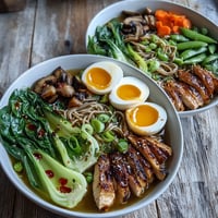 Warm Healthy Miso Chicken Noodle Bowls with chicken and bok choy in a savory broth.